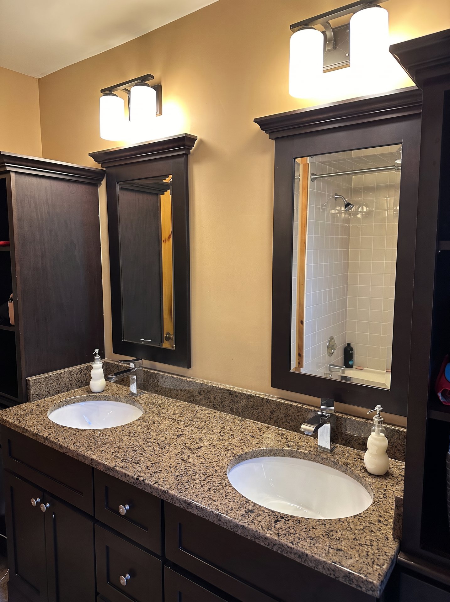 Full bathroom with double granite vanity