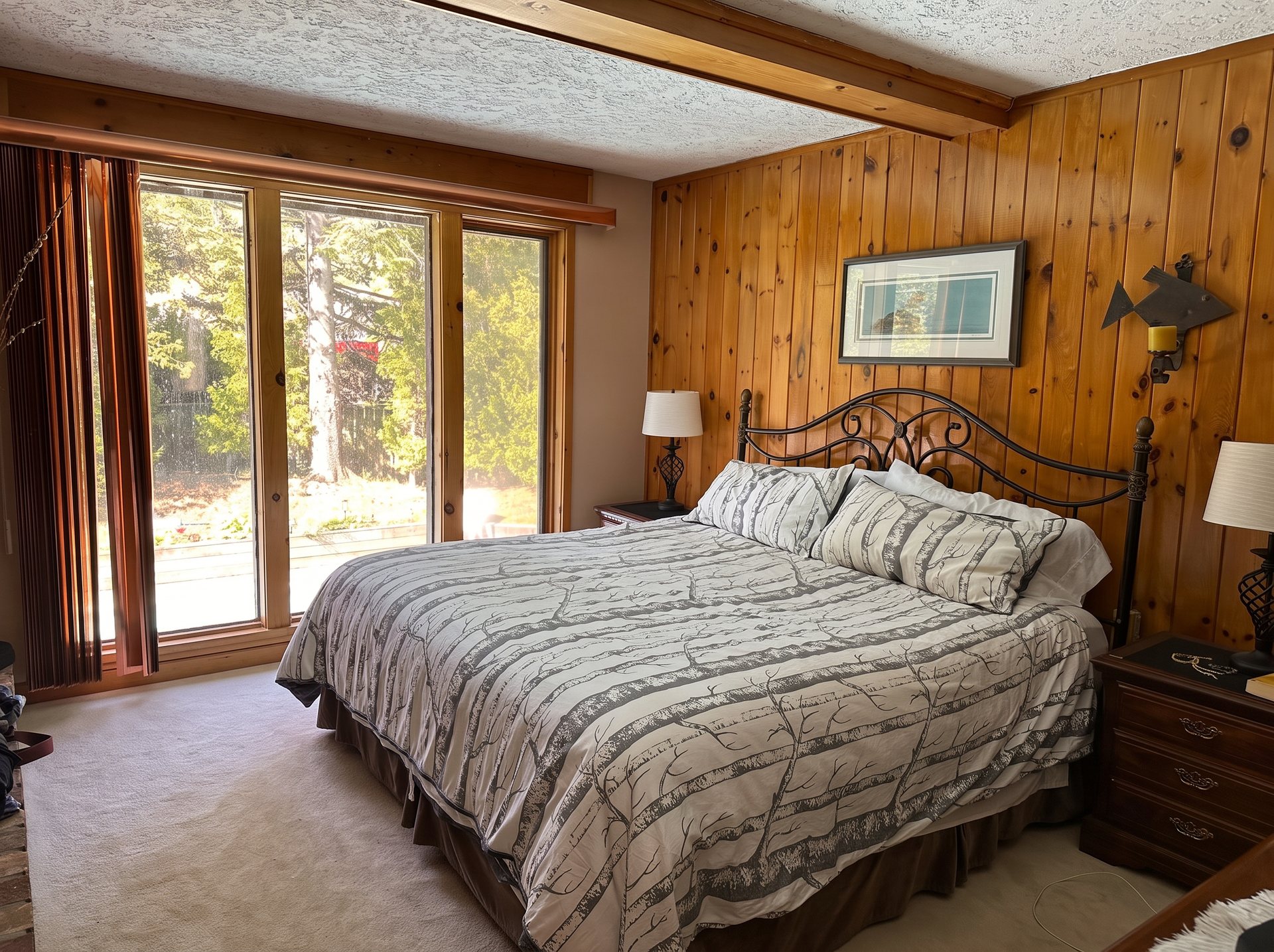 Primary bedroom with king bed and walkout to the deck